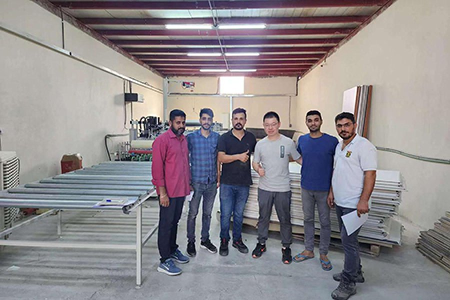 Full automatic lamination wrapping machine installed for WPC door production line in Abudahabi UAE